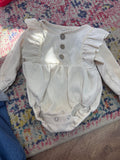 Cream Ruffle Button Long Sleeve Bodysuit