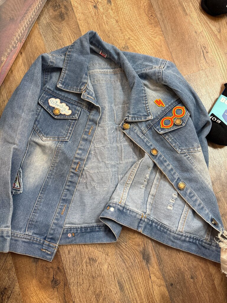 Worn Denim Jacket with Patches and Embellishments