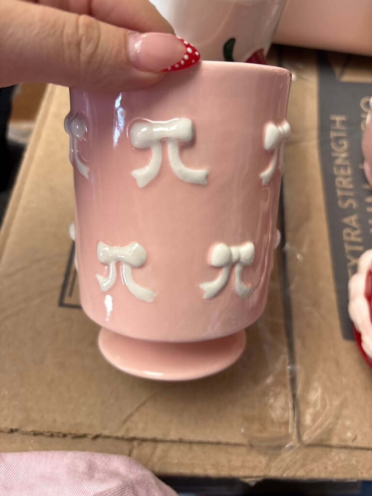 Pink Ceramic Cup with White Bow Design
