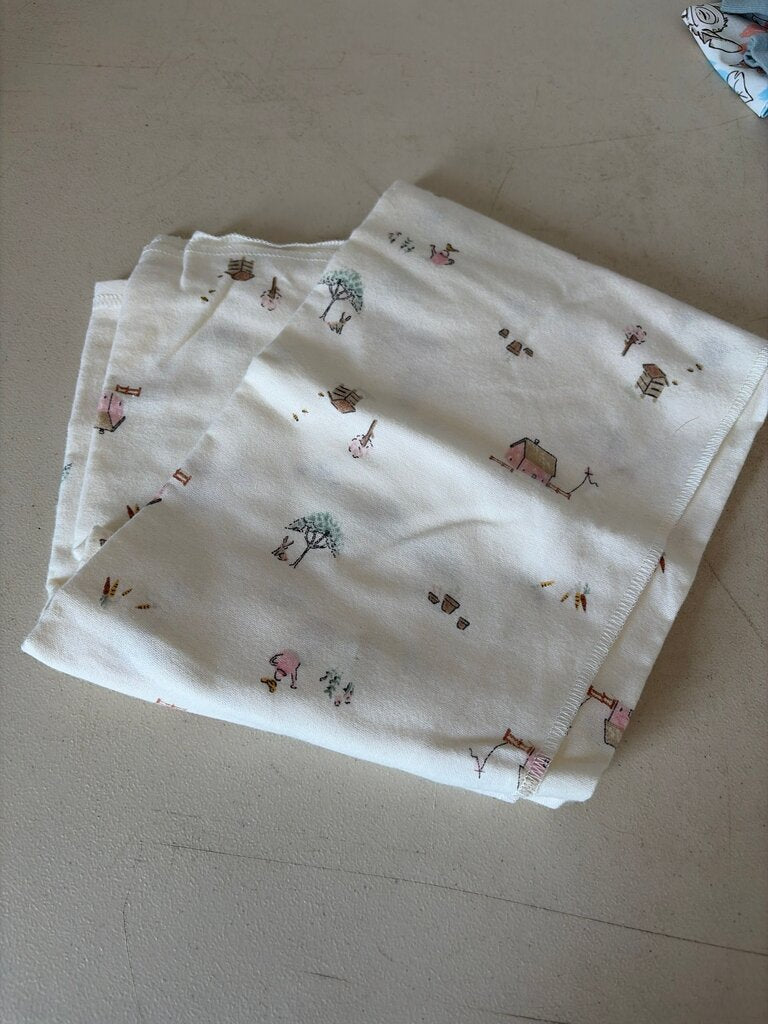 Cotton Kids' swaddled with Cute Farm Prints